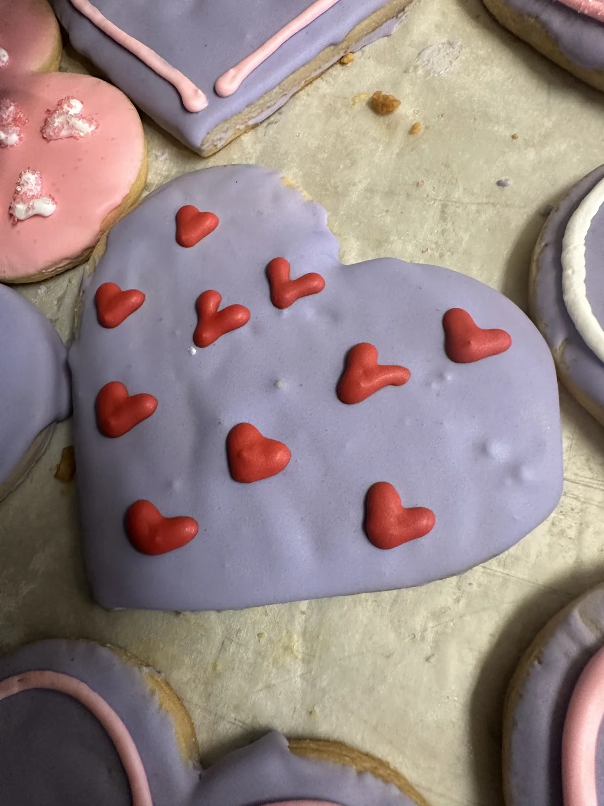 Hand-decorated heart cookies in pink and lavender